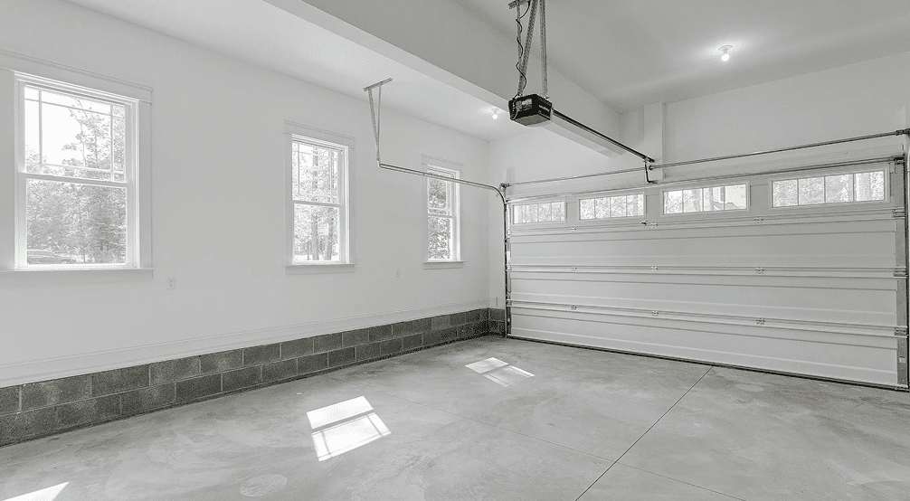 Sunlit garage with windows and white walls